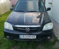 Чорний Мазда Трибьют, об'ємом двигуна 2 л та пробігом 300 тис. км за 3364 $, фото 1 на Automoto.ua