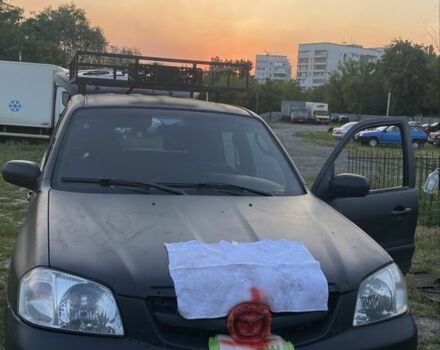 Чорний Мазда Трибьют, об'ємом двигуна 2 л та пробігом 200 тис. км за 3500 $, фото 5 на Automoto.ua