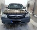 Черный Мазда Трибьют, объемом двигателя 2 л и пробегом 2 тыс. км за 2600 $, фото 1 на Automoto.ua