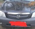 Чорний Мазда Трибьют, об'ємом двигуна 2 л та пробігом 300 тис. км за 1800 $, фото 1 на Automoto.ua