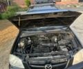 Чорний Мазда Трибьют, об'ємом двигуна 1.99 л та пробігом 237 тис. км за 5000 $, фото 16 на Automoto.ua