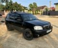 Чорний Мазда Трибьют, об'ємом двигуна 1.99 л та пробігом 237 тис. км за 5000 $, фото 1 на Automoto.ua