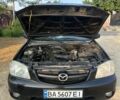 Чорний Мазда Трибьют, об'ємом двигуна 1.99 л та пробігом 237 тис. км за 5000 $, фото 15 на Automoto.ua