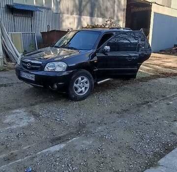 Чорний Мазда Трибьют, об'ємом двигуна 2 л та пробігом 267 тис. км за 4800 $, фото 14 на Automoto.ua