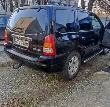 Чорний Мазда Трибьют, об'ємом двигуна 2 л та пробігом 267 тис. км за 4800 $, фото 12 на Automoto.ua
