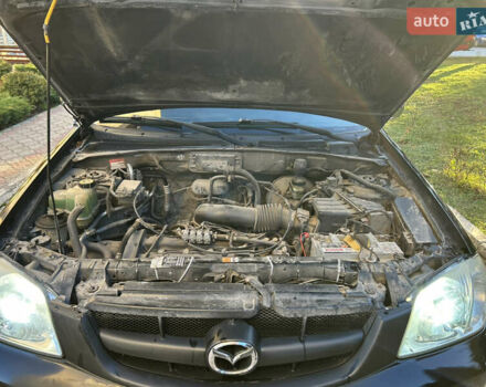 Черный Мазда Трибьют, объемом двигателя 2 л и пробегом 267 тыс. км за 4999 $, фото 39 на Automoto.ua
