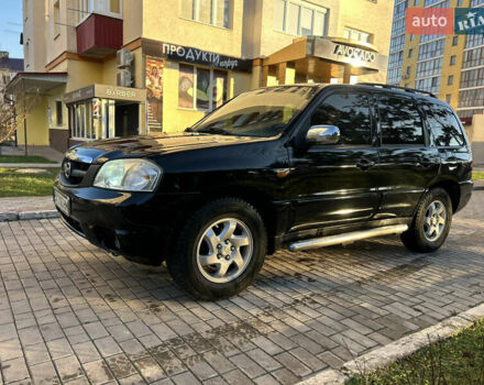 Черный Мазда Трибьют, объемом двигателя 2 л и пробегом 267 тыс. км за 4999 $, фото 4 на Automoto.ua