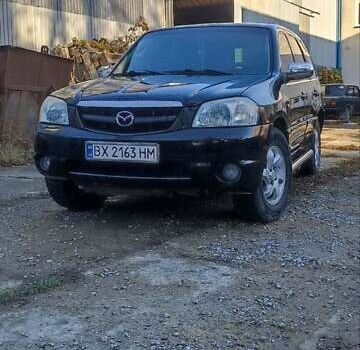 Чорний Мазда Трибьют, об'ємом двигуна 2 л та пробігом 267 тис. км за 4800 $, фото 11 на Automoto.ua