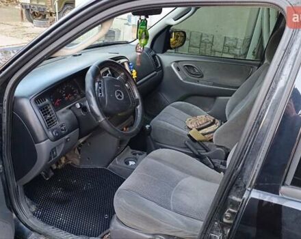 Чорний Мазда Трибьют, об'ємом двигуна 2 л та пробігом 267 тис. км за 4800 $, фото 2 на Automoto.ua