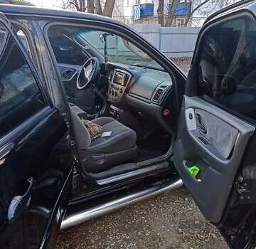 Чорний Мазда Трибьют, об'ємом двигуна 2 л та пробігом 267 тис. км за 4800 $, фото 13 на Automoto.ua