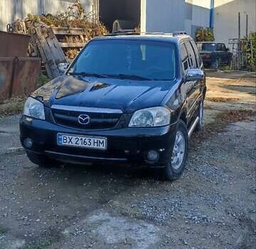 Чорний Мазда Трибьют, об'ємом двигуна 2 л та пробігом 267 тис. км за 4800 $, фото 10 на Automoto.ua
