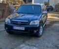 Чорний Мазда Трибьют, об'ємом двигуна 2 л та пробігом 267 тис. км за 4800 $, фото 10 на Automoto.ua