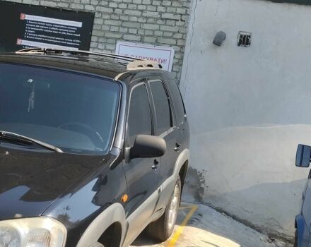 Черный Мазда Трибьют, объемом двигателя 2.3 л и пробегом 190 тыс. км за 5500 $, фото 3 на Automoto.ua