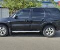 Чорний Мазда Трибьют, об'ємом двигуна 2.26 л та пробігом 258 тис. км за 5100 $, фото 3 на Automoto.ua