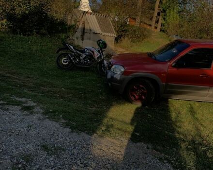 Червоний Мазда Трибьют, об'ємом двигуна 2 л та пробігом 460 тис. км за 4550 $, фото 6 на Automoto.ua