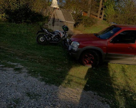 Красный Мазда Трибьют, объемом двигателя 1.99 л и пробегом 460 тыс. км за 4550 $, фото 2 на Automoto.ua