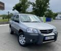 Серый Мазда Трибьют, объемом двигателя 2 л и пробегом 180 тыс. км за 3700 $, фото 1 на Automoto.ua