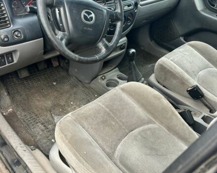 Серый Мазда Трибьют, объемом двигателя 2.5 л и пробегом 300 тыс. км за 1200 $, фото 2 на Automoto.ua