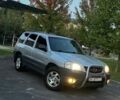 Сірий Мазда Трибьют, об'ємом двигуна 2 л та пробігом 230 тис. км за 3999 $, фото 1 на Automoto.ua
