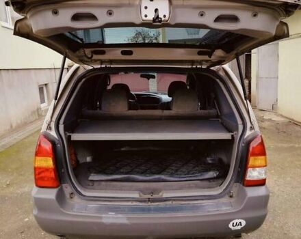 Сірий Мазда Трибьют, об'ємом двигуна 2 л та пробігом 301 тис. км за 5200 $, фото 12 на Automoto.ua
