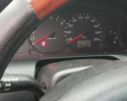 Сірий Мазда Трибьют, об'ємом двигуна 2 л та пробігом 364 тис. км за 2500 $, фото 4 на Automoto.ua