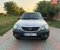 Сірий Мазда Трибьют, об'ємом двигуна 2 л та пробігом 300 тис. км за 3900 $, фото 1 на Automoto.ua