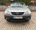 Серый Мазда Трибьют, объемом двигателя 1.99 л и пробегом 127 тыс. км за 6800 $, фото 1 на Automoto.ua