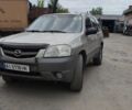 Сірий Мазда Трибьют, об'ємом двигуна 2 л та пробігом 307 тис. км за 2700 $, фото 1 на Automoto.ua