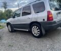 Сірий Мазда Трибьют, об'ємом двигуна 2 л та пробігом 185 тис. км за 5300 $, фото 1 на Automoto.ua