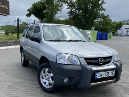 Серый Мазда Трибьют, объемом двигателя 2 л и пробегом 180 тыс. км за 3700 $, фото 1 на Automoto.ua