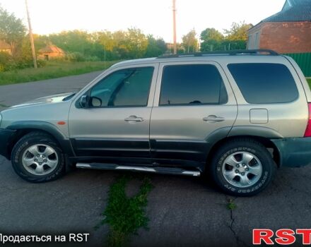 Серый Мазда Трибьют, объемом двигателя 3 л и пробегом 209 тыс. км за 5000 $, фото 1 на Automoto.ua