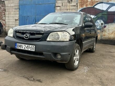 Серый Мазда Трибьют, объемом двигателя 2.5 л и пробегом 300 тыс. км за 1200 $, фото 1 на Automoto.ua