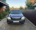 Синий Мазда Трибьют, объемом двигателя 2 л и пробегом 240 тыс. км за 4900 $, фото 1 на Automoto.ua