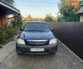 Синий Мазда Трибьют, объемом двигателя 2 л и пробегом 240 тыс. км за 4900 $, фото 1 на Automoto.ua