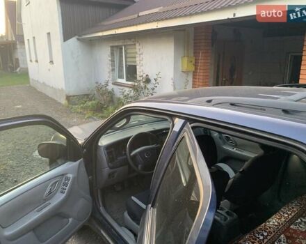 Синий Мазда Трибьют, объемом двигателя 2 л и пробегом 240 тыс. км за 4900 $, фото 3 на Automoto.ua
