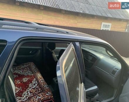 Синий Мазда Трибьют, объемом двигателя 2 л и пробегом 240 тыс. км за 4900 $, фото 4 на Automoto.ua