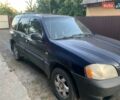 Синий Мазда Трибьют, объемом двигателя 2 л и пробегом 240 тыс. км за 4900 $, фото 2 на Automoto.ua