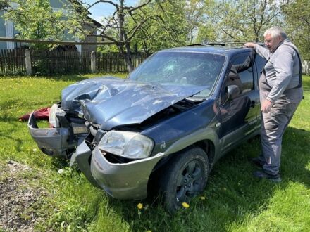 Синій Мазда Трибьют, об'ємом двигуна 3 л та пробігом 200 тис. км за 2600 $, фото 1 на Automoto.ua