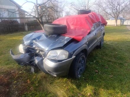 Синий Мазда Трибьют, объемом двигателя 0 л и пробегом 200 тыс. км за 2100 $, фото 1 на Automoto.ua