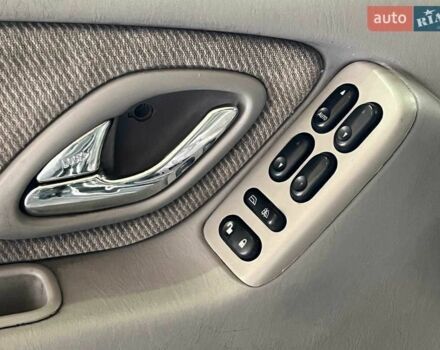 Зелений Мазда Трибьют, об'ємом двигуна 2 л та пробігом 358 тис. км за 3800 $, фото 10 на Automoto.ua