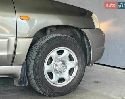 Зелений Мазда Трибьют, об'ємом двигуна 2 л та пробігом 358 тис. км за 3800 $, фото 4 на Automoto.ua