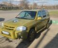 Зелений Мазда Трибьют, об'ємом двигуна 2 л та пробігом 348 тис. км за 3800 $, фото 1 на Automoto.ua