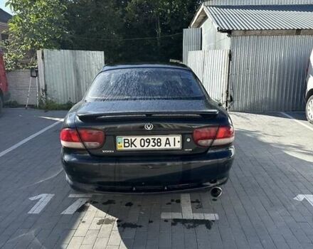 Черный Мазда Кседос 6, объемом двигателя 2 л и пробегом 420 тыс. км за 1500 $, фото 1 на Automoto.ua