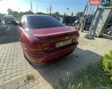 Красный Мазда Кседос 6, объемом двигателя 2 л и пробегом 300 тыс. км за 2200 $, фото 3 на Automoto.ua