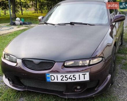 Червоний Мазда Кседос 6, об'ємом двигуна 2 л та пробігом 394 тис. км за 2999 $, фото 1 на Automoto.ua