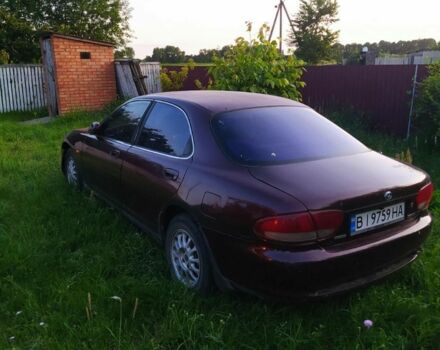 Красный Мазда Кседос 6, объемом двигателя 2 л и пробегом 300 тыс. км за 850 $, фото 1 на Automoto.ua