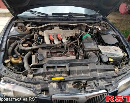 Синий Мазда Кседос 6, объемом двигателя 2 л и пробегом 305 тыс. км за 1100 $, фото 4 на Automoto.ua
