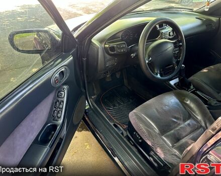 Синий Мазда Кседос 6, объемом двигателя 2 л и пробегом 320 тыс. км за 1450 $, фото 5 на Automoto.ua