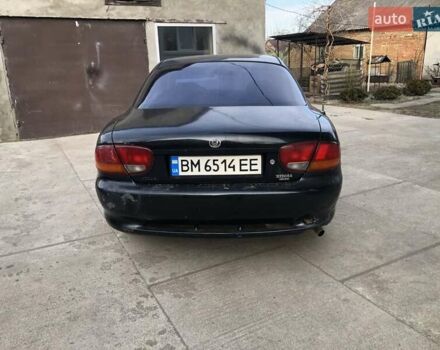 Синий Мазда Кседос 6, объемом двигателя 2 л и пробегом 300 тыс. км за 1350 $, фото 1 на Automoto.ua