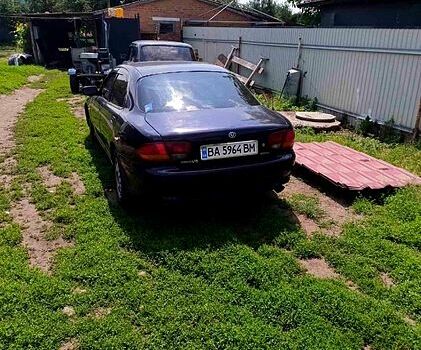 Синий Мазда Кседос 6, объемом двигателя 2 л и пробегом 231 тыс. км за 1500 $, фото 1 на Automoto.ua